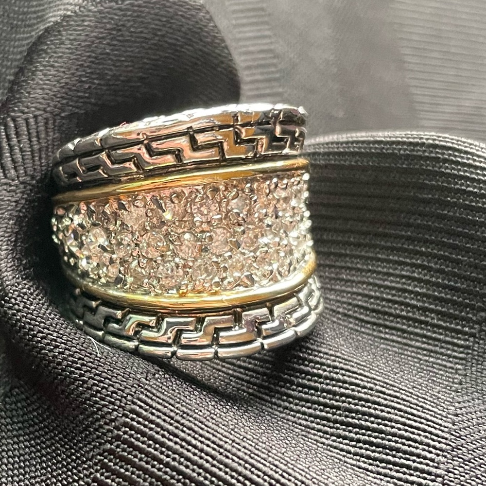 Large Silver tone ring with cz stones and gold trim inset. Approx Size is 7.4